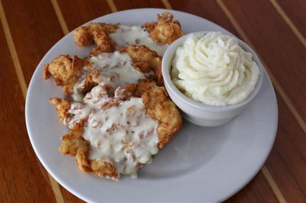 Buttermilk Chicken - All natural boneless breast pounded thin flash fried served with garlic mash & white cream gravy