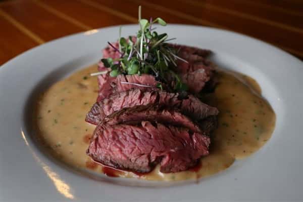 Hanger Steak - Aged 10oz Certified Angus Beef(r) pan seared & served over a smoked gouda cream sauce