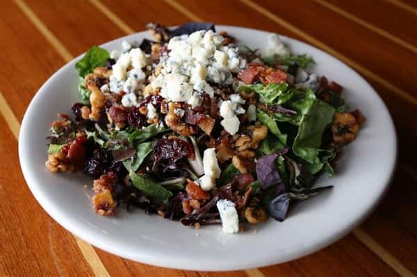 House salad - Artisan greens with gorganzola crumbles, bacon, dried cranberries & candied walnuts