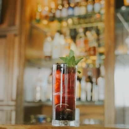 Cocktail garnished with mint at the bar