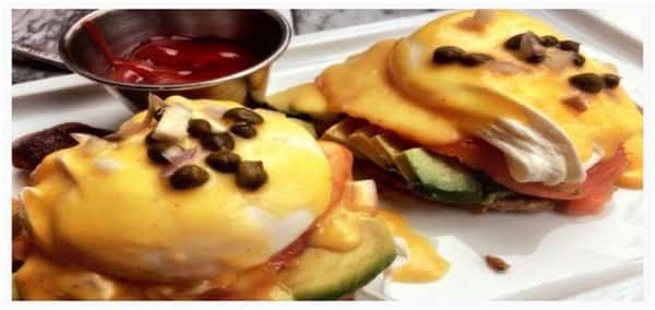 Smoked Natural Ham and Avocado Eggs Benedict with fresh capers