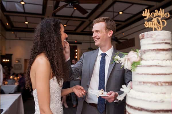 Bride and groom enjoying their wedding cake