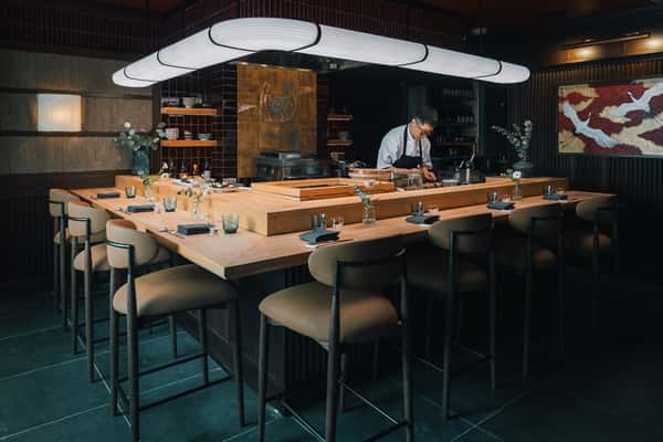Blue Ribbon Sushi dining counter in Pacific Palisades with a sushi chef preparing Japanese cuisine in an intimate, modern setting