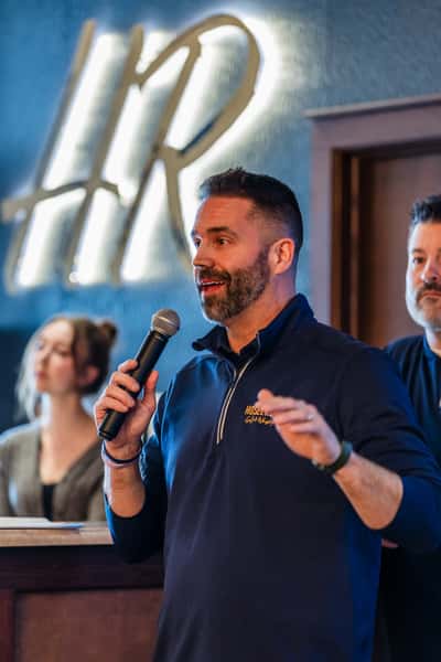 Man using Microphone at Hosel Rockets Event