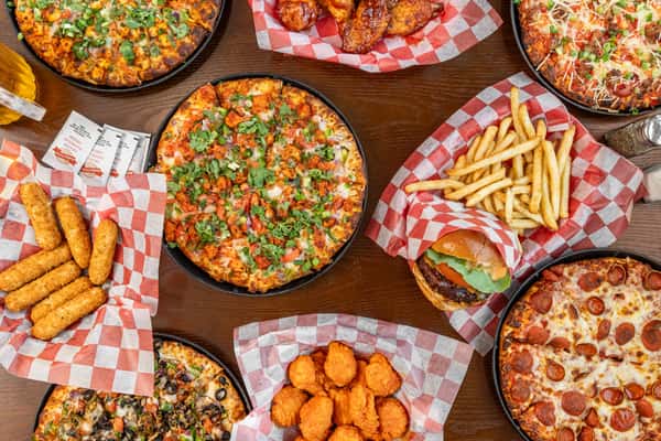 A variety of dishes on a table from Jack's Pizza