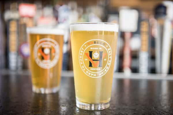 Crisp craft lager served in branded pint glasses at a local brewery taproom, showcasing fresh draft beer.