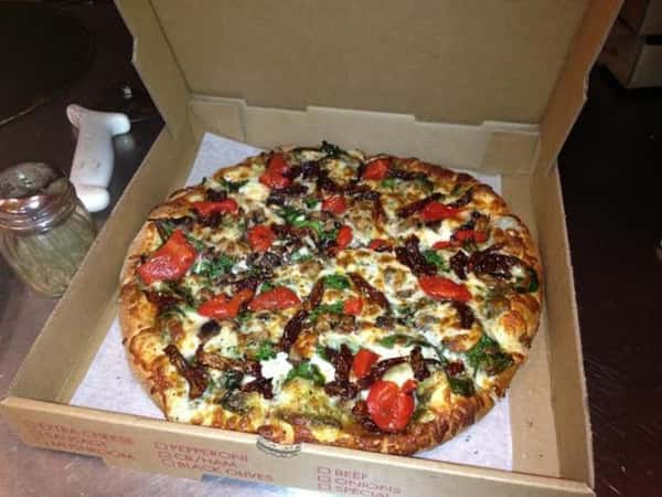 Villa Supreme pie in takeout box