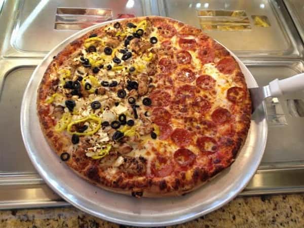 half yellow pepper and black olives and half pepperoni