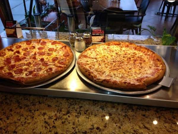 pizza pies on display