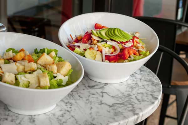 two bowls of salads
