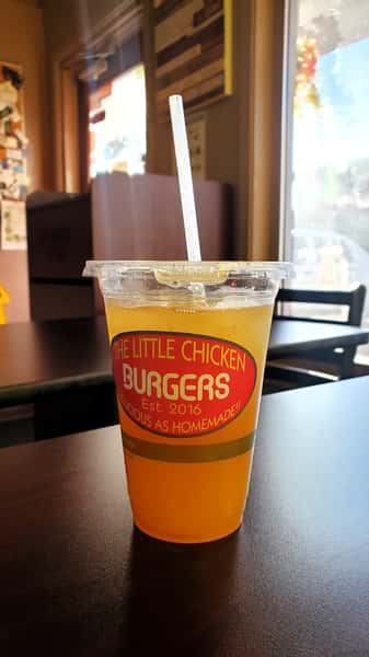 Close up of a plastic drink with the logo on the side of the cup