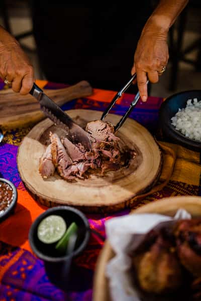 slicing meat on the chopping board