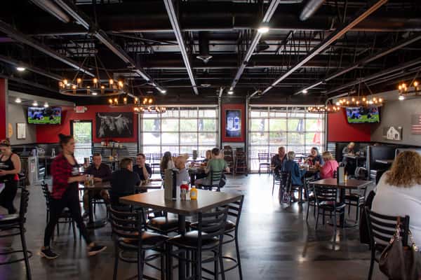 Outdoor patio dining with retention pond fountain