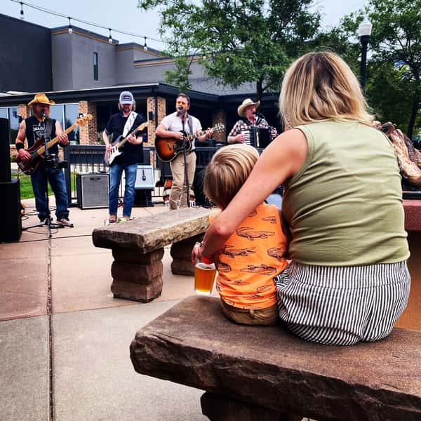 Mother and son enjoying live music