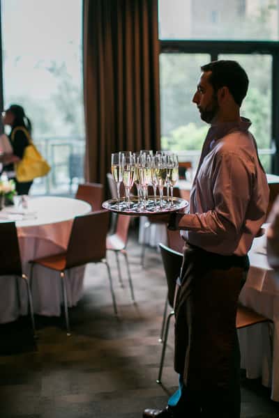 Waiter serving beverages