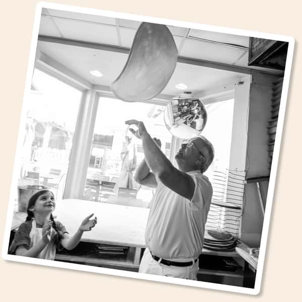 tossing pizza