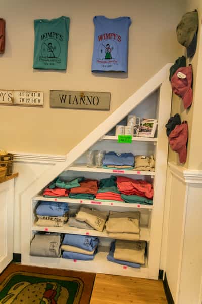 display of hats, shirts, mugs, and artwork