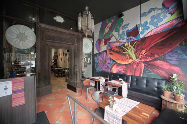 Colorful floral wall mural in dining area