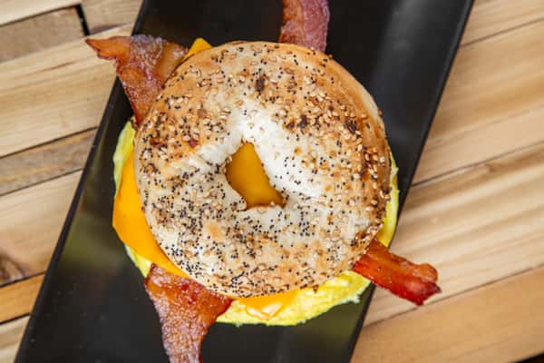 Breakfast sandwich on an everything bagel with egg, cheese, and bacon at Wisco Coffee Company