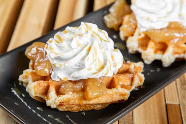 Apple Belgian waffle topped with warm cinnamon apples and whipped cream at Wisco Coffee Company