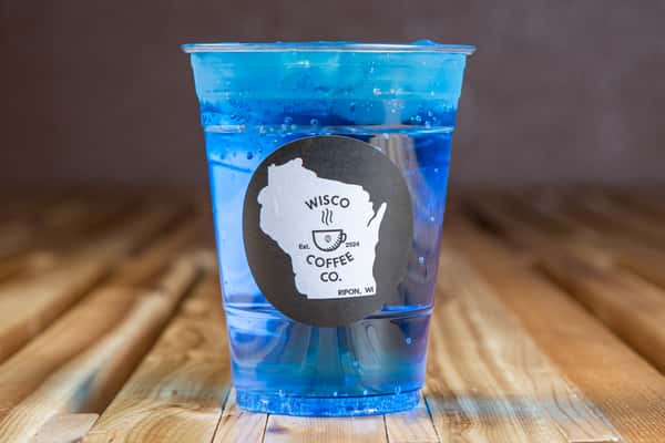 Bright blue iced energy drink with ice in a branded cup at Wisco Coffee Company