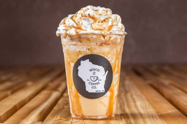 Caramel drizzle blended iced coffee topped with whipped cream at Wisco Coffee Company