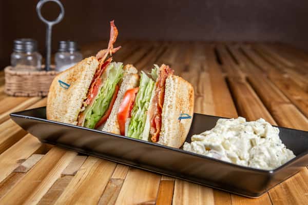 BLT sandwich with crispy bacon, lettuce, and tomato on toasted bread at Wisco Coffee Company