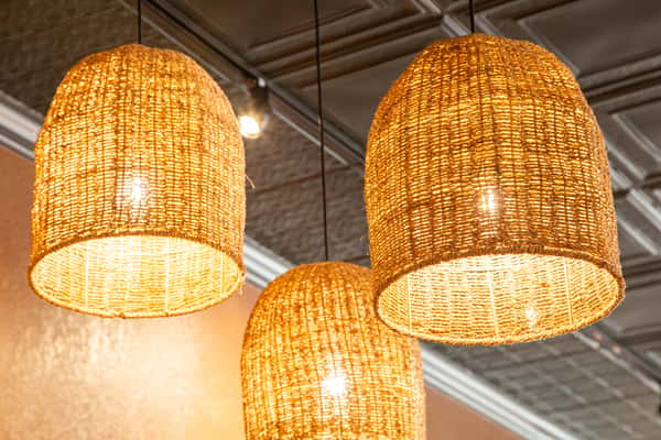 Warm café interior with rustic wood décor, cozy lighting, and decorative signage, creating a welcoming coffee shop atmosphere with a homey, inviting vibe.