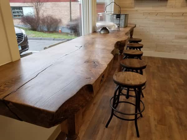 Rustic bar top with wooden stools