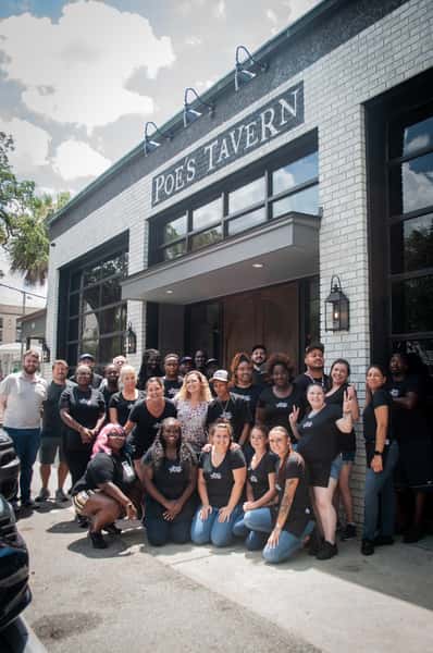 Poe's employees in front of restaurant