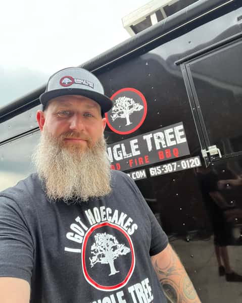 Charlie Elben next to food truck