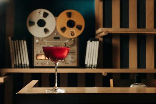Drink in front of reel-to-reel