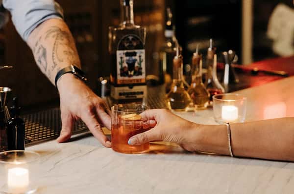 Bartender serving cocktail