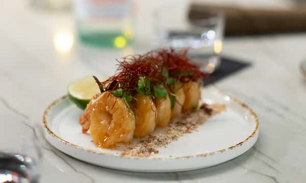 Shrimp on white dinner plate