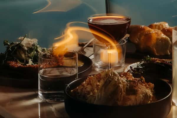 Food and cocktails on a dinner table