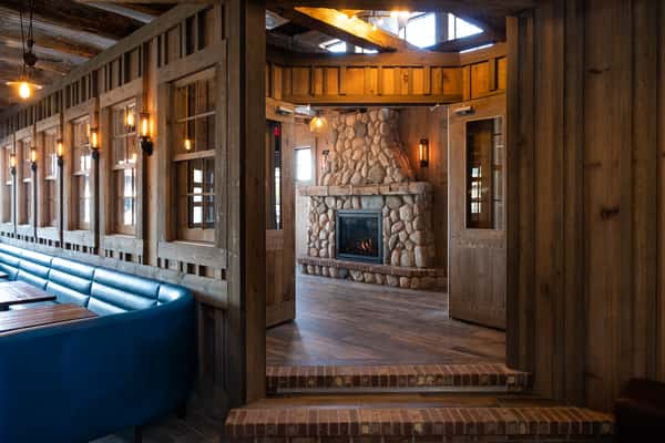 room with large stone fireplace