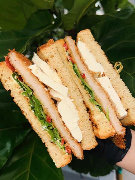 You said you were “just grabbing lunch.”
This sandwich said hold my aioli.
Crispy pork cutlet, fresh mozz, arugula, cherry peppers, garlic black pepper aioli. 🔥