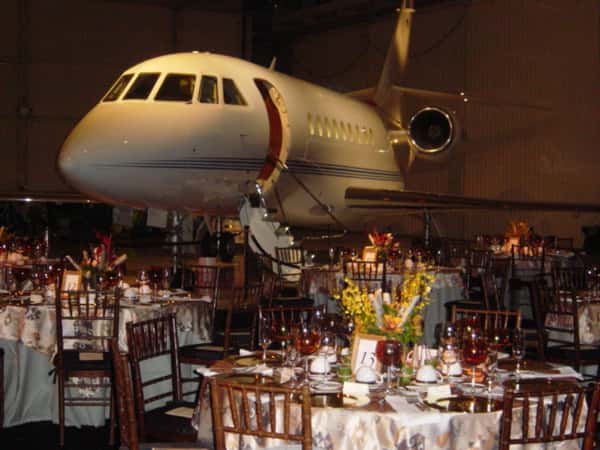 catering table in front of a plane