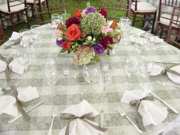floral arrangement in the middle of a decorated table