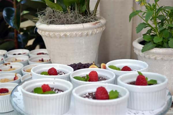 dessert topped with raspberries and garnish