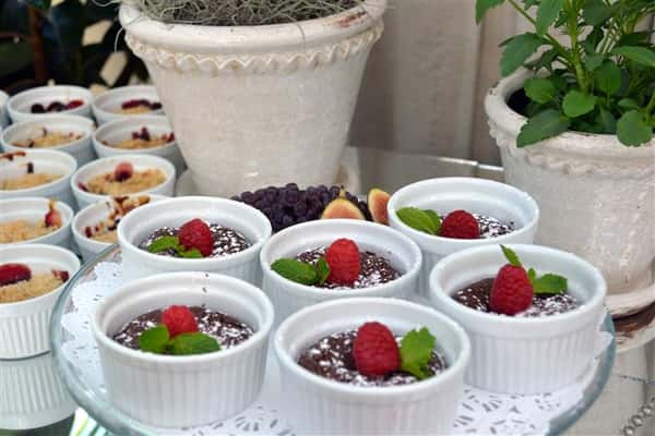 dessert topped with raspberries and garnish