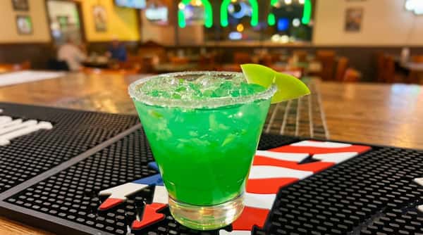 Bright green lime margarita served at the bar at Maya Mexican Restaurant, a festive Tex-Mex restaurant in Homewood and Alabaster, Alabama.