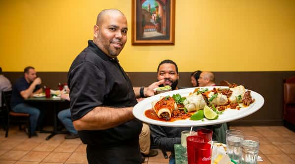 Waiter serving food.