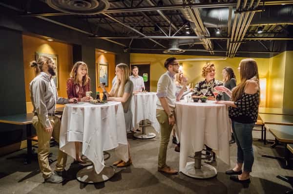 diners standing at tables