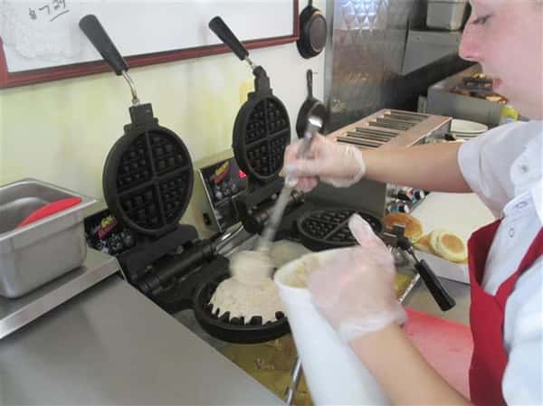 team member making waffles