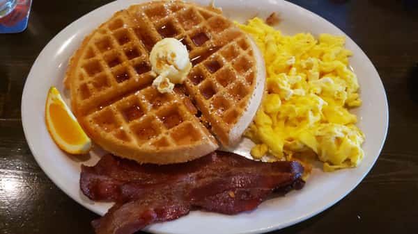 Waffles with scrambled eggs and bacon