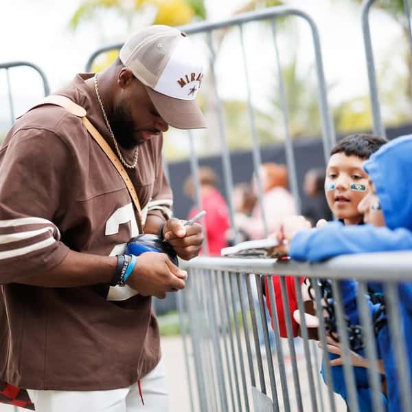 daniel signing an autograph