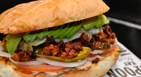 Try our Chorizo torta, a layer of refried beans, fresh cut tomatoes, onions, jalapenos, mayonnaise, sliced avocado, chipotle sauce, and mozzarella cheese on a traditional Mexican bread. (Fridays and Saturday only)