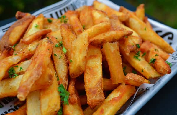 Roman's Kitchen top seller, our Famous Beer-Battered Fries cooked and seasoned to perfection. Too enjoy your fries don't forget to add your favorite dipping sauce.