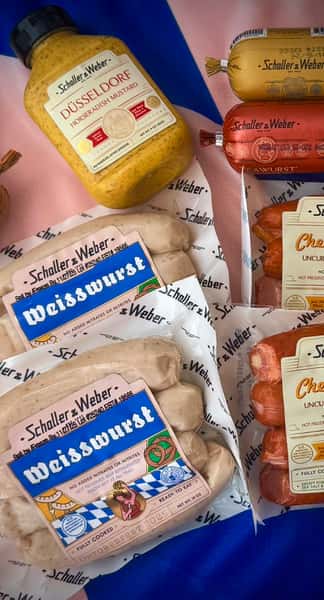 variety of packaged bratwurst and weisswurst sausages in deli display